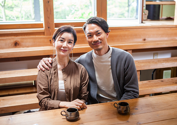 Couple sitting at a wooden table
